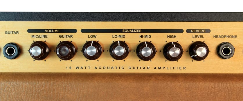 A guitar amplifier dials and input lines for the guitar and headphones.
