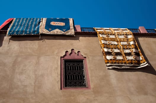 Moroccan building with  newly produced Berber carpets in the Medina of Marrakech