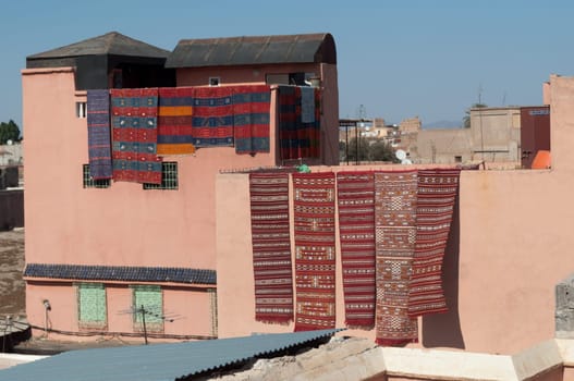 Moroccan building with  newly produced Berber carpets in the Medina of Marrakech