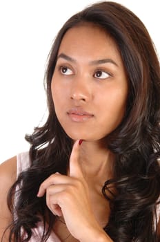 A lovely Asian girl, having one finger under her chin, looking up and thinking, over white.