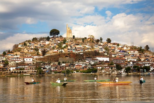 Fishermen Greeting Tourists Janitizo Island Patzcuaro Lake Mexico  Resubmit--In response to comments from reviewer have further processed image to reduce noise and sharpen focus.