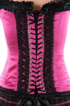 Back of the woman in pink corset with laces isolated over white background