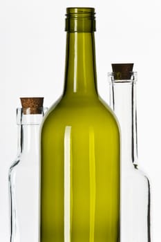 Empty glass bottles with corks isolated on white background