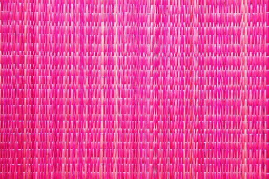 horizontal or vertical bright crimson pink raffia background texture patterns of a table runner