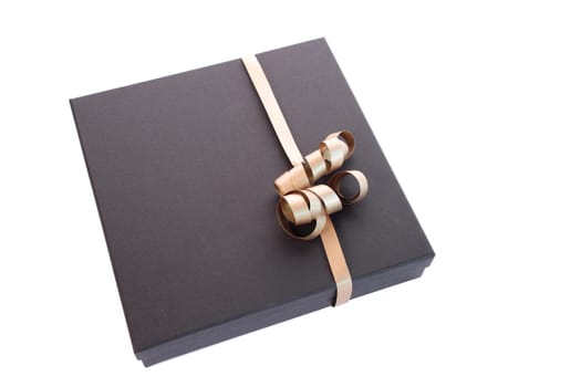 Luxury gift box with a golden bow isolated on a white background