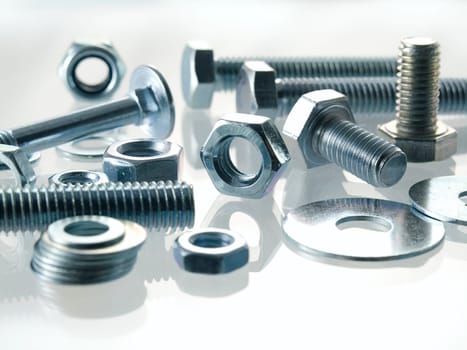 screws and nuts on a white background