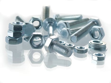 screws and nuts on a white background