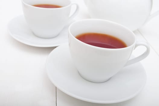 White Cups of Tea and Teapot on White Table