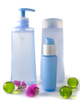 blue cosmetic bottles without labels isolated on white background