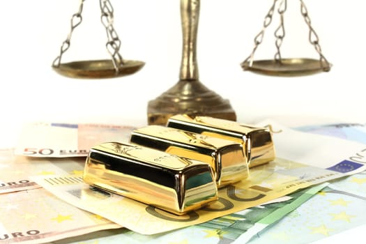Gold bars and euro notes against light background