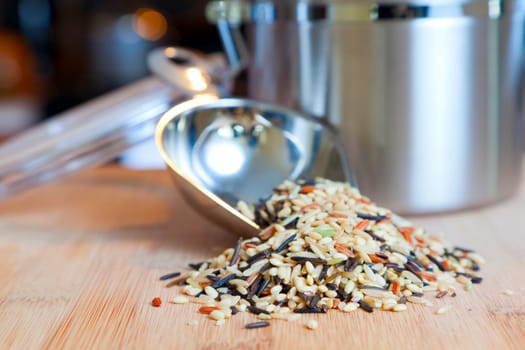 Image of an open jar with wild rice on a cutting board