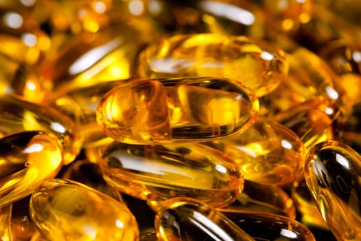 Macro image of a pile of fish oil or omega3 capsules for health