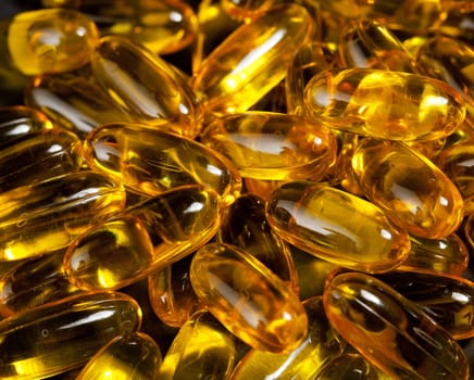 Macro image of a pile of fish oil or omega3 capsules for health