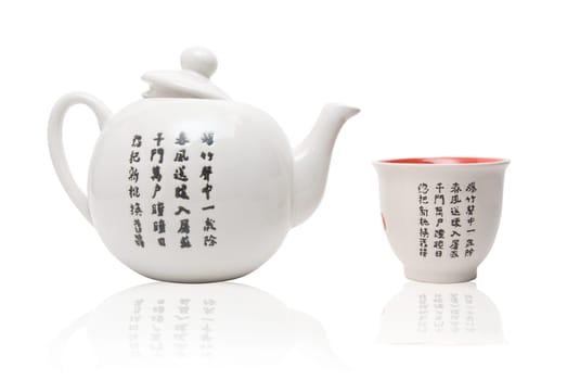 Tea-things in asian style with hieroglyphics. Isolated on white.