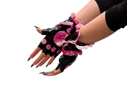 Close-up of girls hand with pink gloves on white