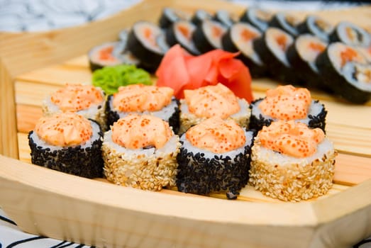 Set of sushi on wood plate