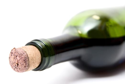 Close-up of bottle of red wine isolated over white background