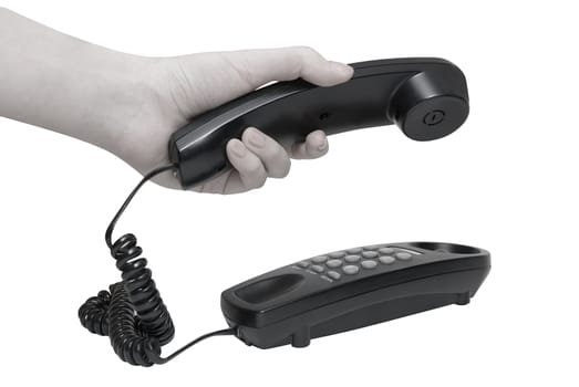 Communication on white. office black telephone with hands dialing.