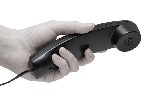 Communication on white. office black telephone with hand dialing.