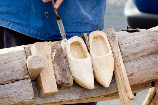 making of wooden shoes. ShoesTraditional skill of making Dutch