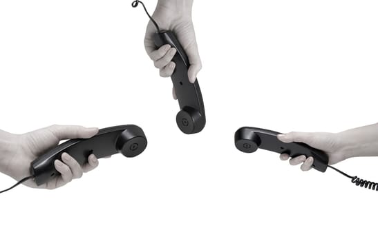Communication on white. office black telephones with hands dialing.