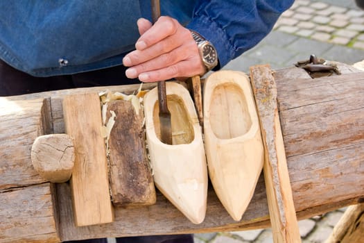 making of wooden shoes. ShoesTraditional skill of making Dutch