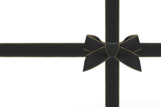 A black velvet bow with matching ribbon.