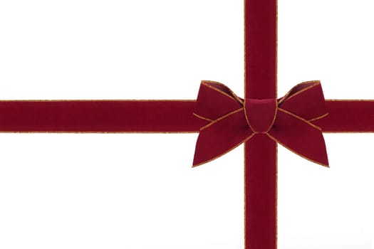 A red velvet bow with matching ribbon.
