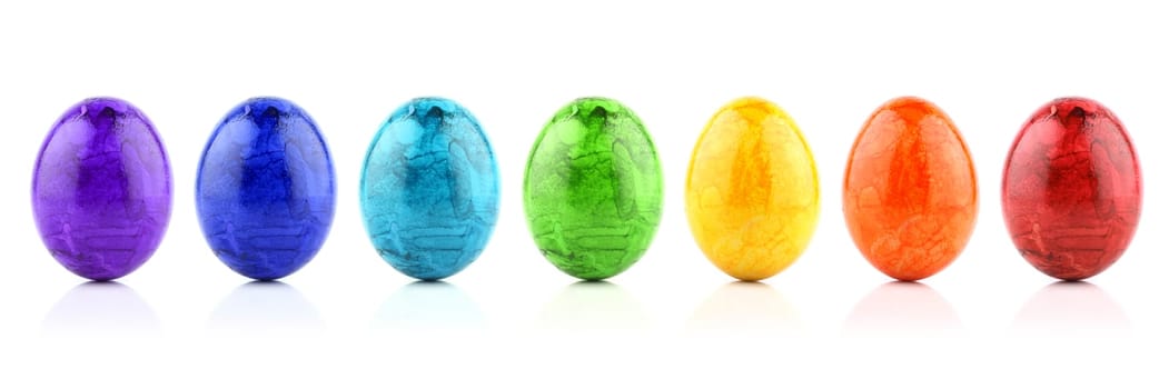 Colorful Easter eggs in rainbow colors in a row.