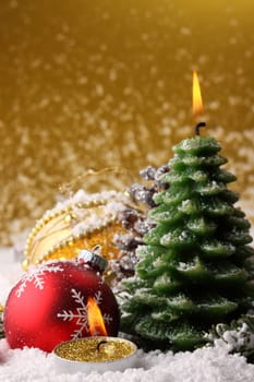 Christmas time still life with snow,crescents,fir branches,Christmas tree baubles and pine cones.