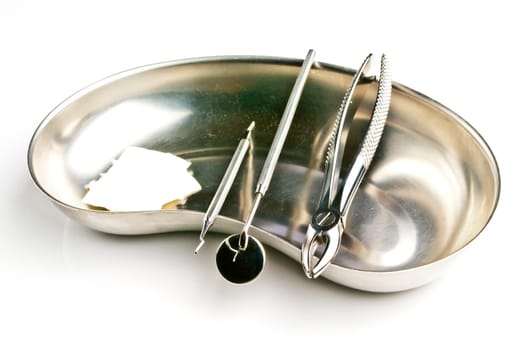 Kidney dish with dental instruments