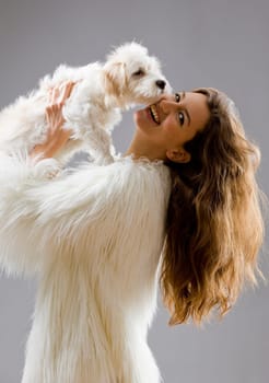 sexy attractive woman posing glamorous with her pet