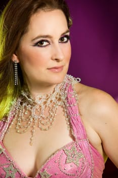 beautiful woman dancing the oriental style dance called belly dance