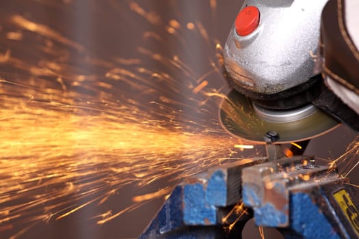 A cut-off grinder in use.