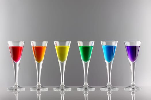 A range of drinks in rainbow colors