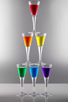 A range of drinks in rainbow colors