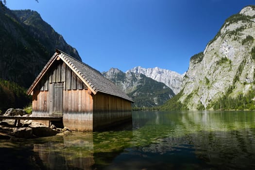 Boathouse on the shores of Lake Obersee with a view of the Watzmann