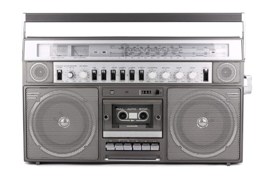 Old radio with cassette deck on white background
