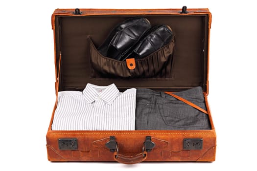 Packed old leather suitcase.