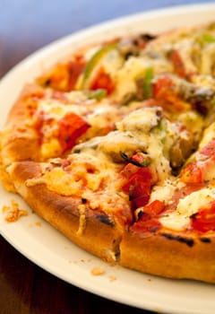 Close-up of a delicious pizza in a greek outdoor restaurant