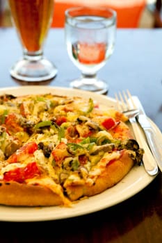 Close-up of a delicious pizza in a greek outdoor restaurant
