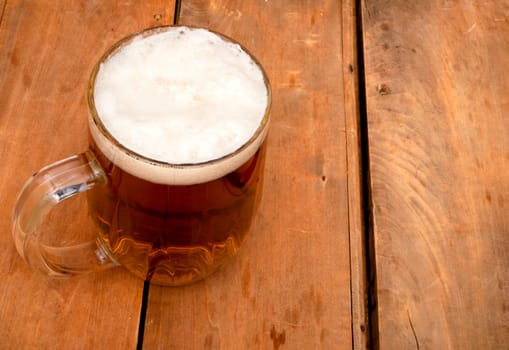 Glass Full of Beer on Old Wooden Table