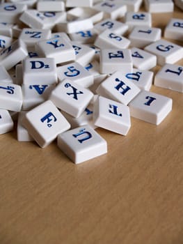 Scrabble pieces over wood background