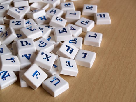 Scrabble pieces over wood background