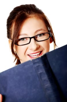 Closeup portrait of smiling,caucasian girl with a book over white