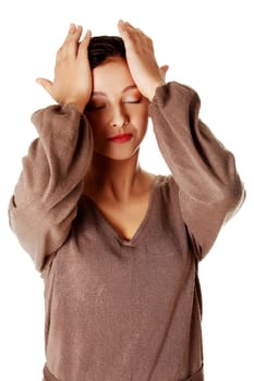 Young pretty caucasian woman having a headache.
