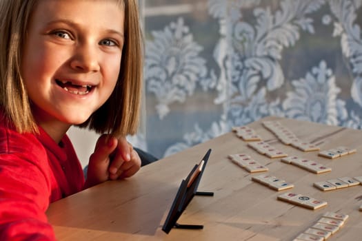 Girl plays rummikub