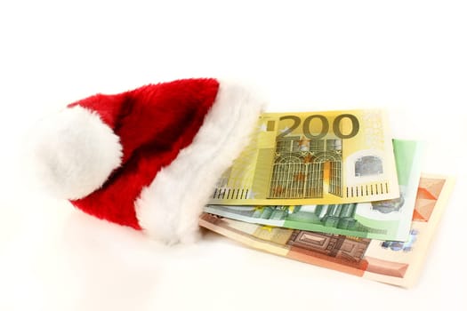 Santa hat with euro bills against white background