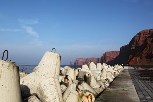 Cliffs of Heligoland with the Lange Anna in the background,in the foreground a protective wall of tetrapods