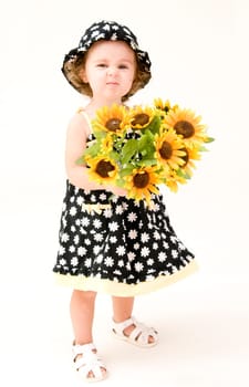 Baby Girl Smelling Flowers